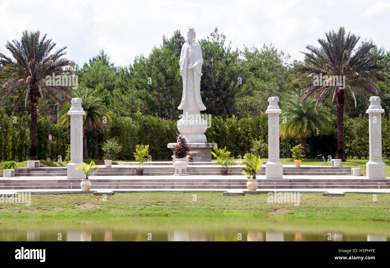 Towering giant Buddha statues in Mims, Florida, a serene and unexpected roadside attraction blending spirituality with quirky travel charm. Stock Photo
