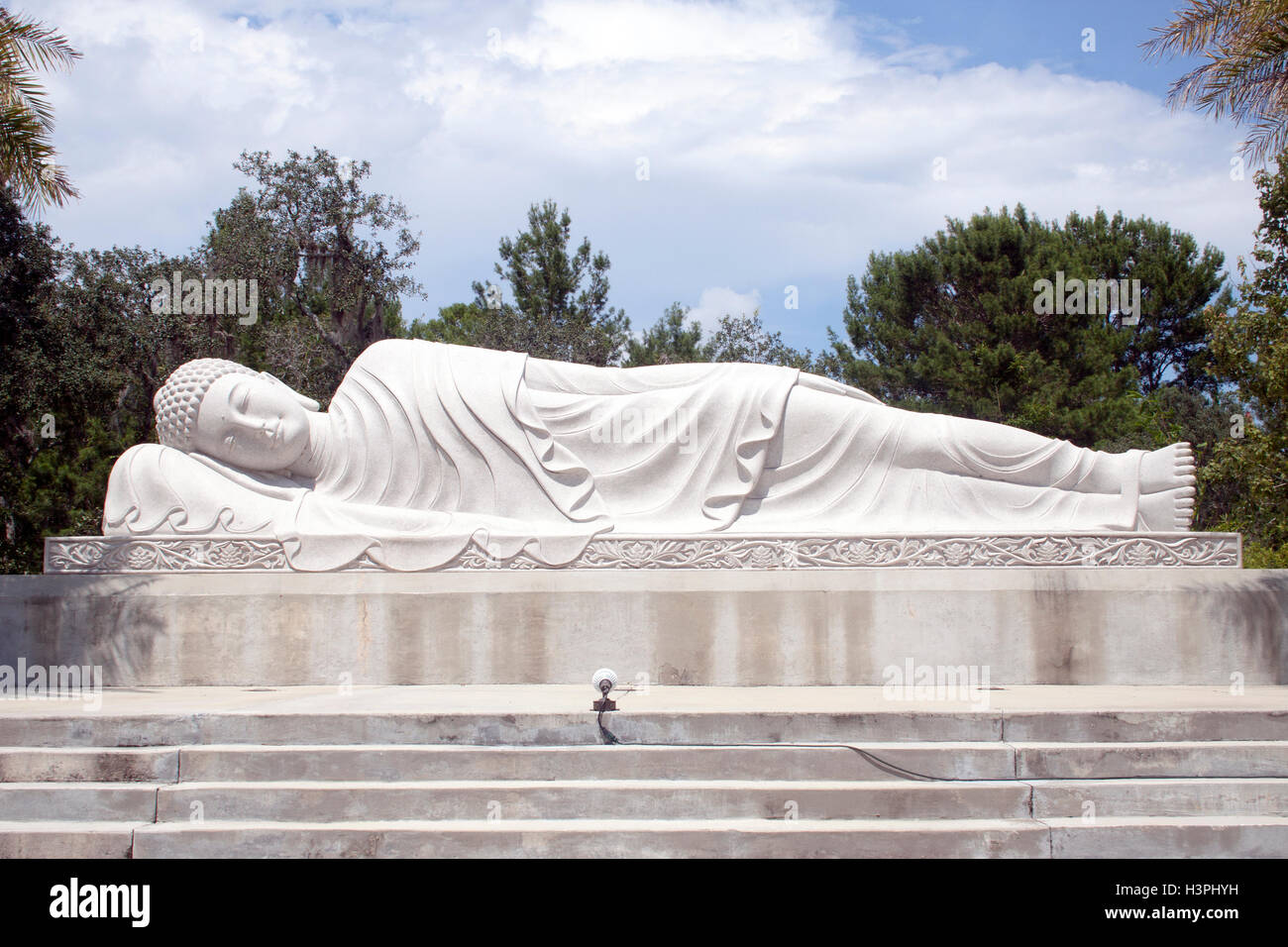 Towering giant Buddha statues in Mims, Florida, a serene and unexpected roadside attraction blending spirituality with quirky travel charm. Stock Photo