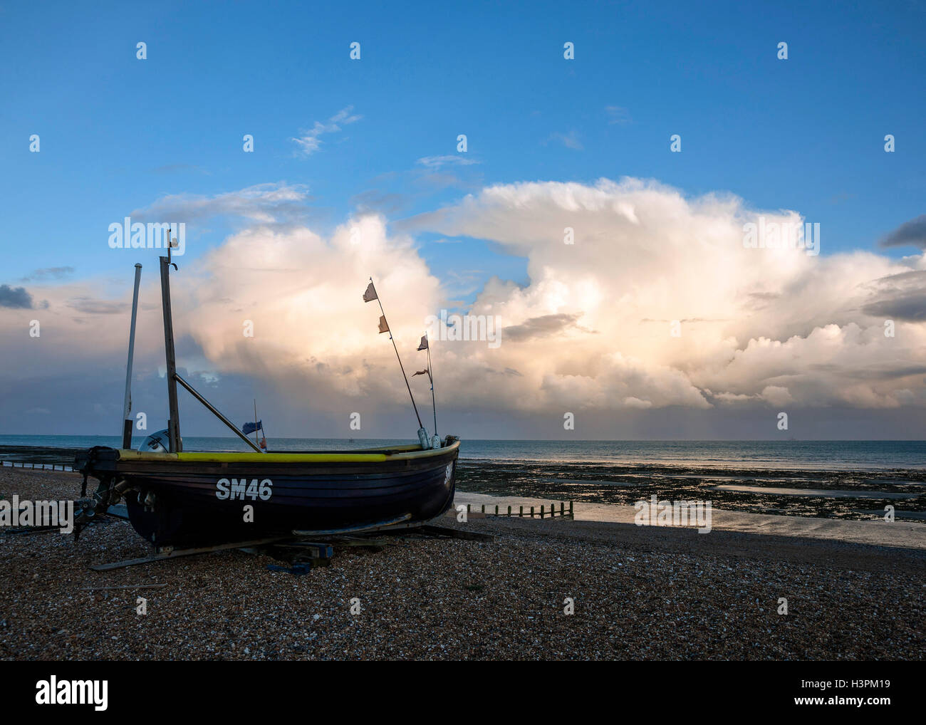 Fishing boat on Worthing beach West Sussex Under dramatic Sky Stock ...