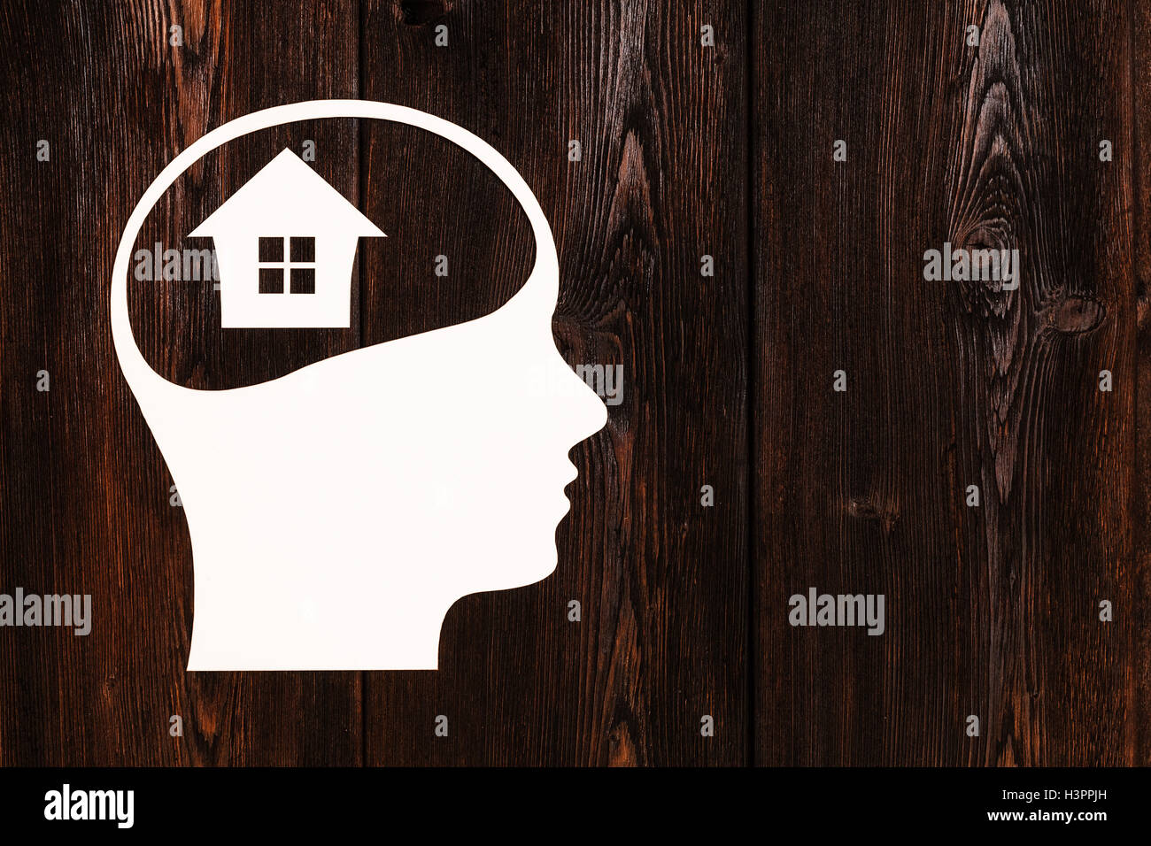 Paper head with house inside. Housing concept. Abstract conceptual image Stock Photo