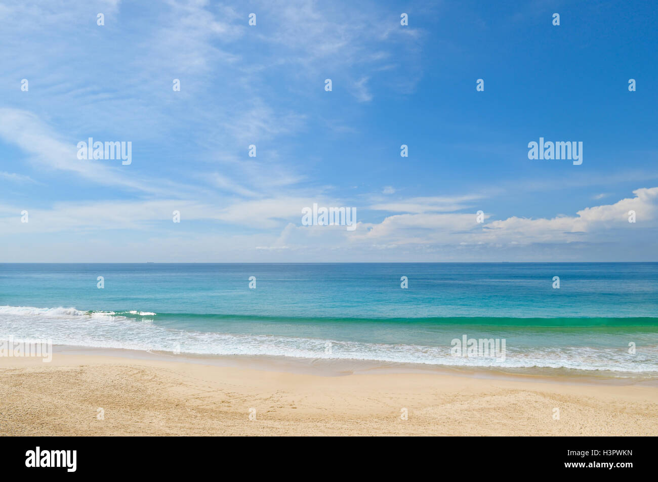 ocean, sandy beach and blue sky Stock Photo - Alamy