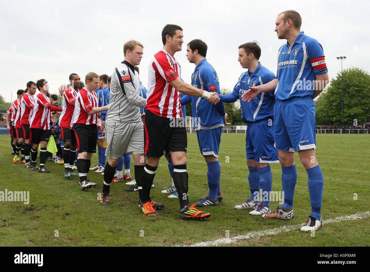 The teams shake hands before kickoff AFC Hornchurch vs Lowestoft