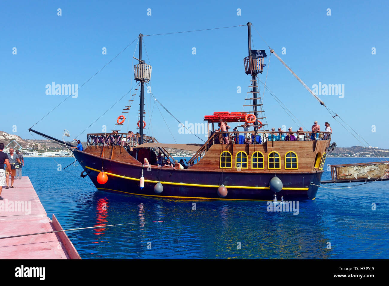 Pirate day trip ship arriving at the harbour at Kefalos Kos, Greece Stock Photo