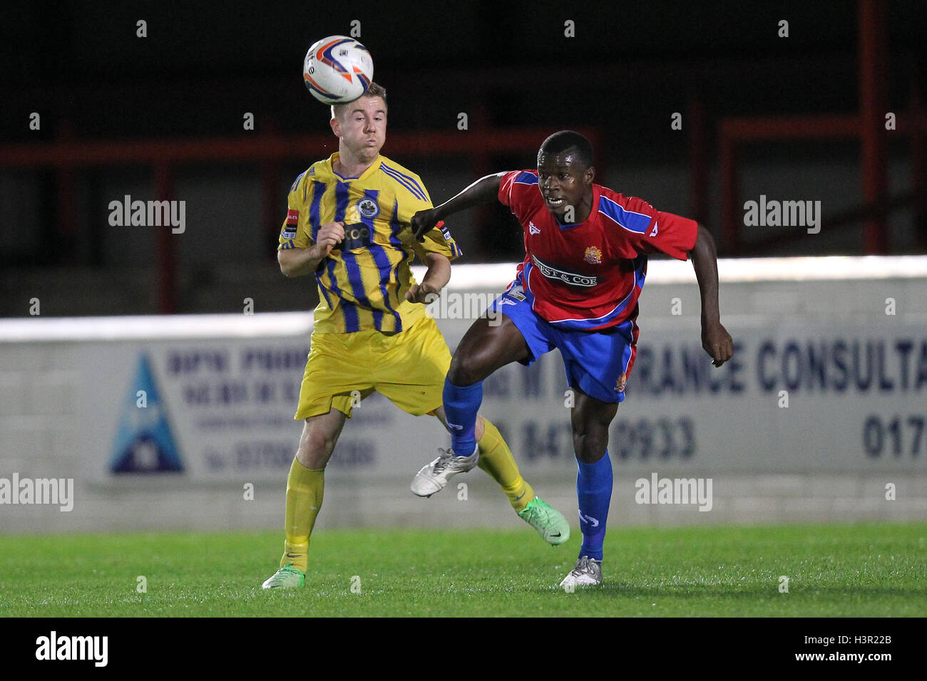 Danny Jones of Romford tangles with Jordan Hibbert of Dagenham - Dagenham & Redbridge vs Romford - Essex FA Senior Cup 3rd Round Football at the London Borough of Barking & Dagenham Stadium - 29/10/13 Stock Photo