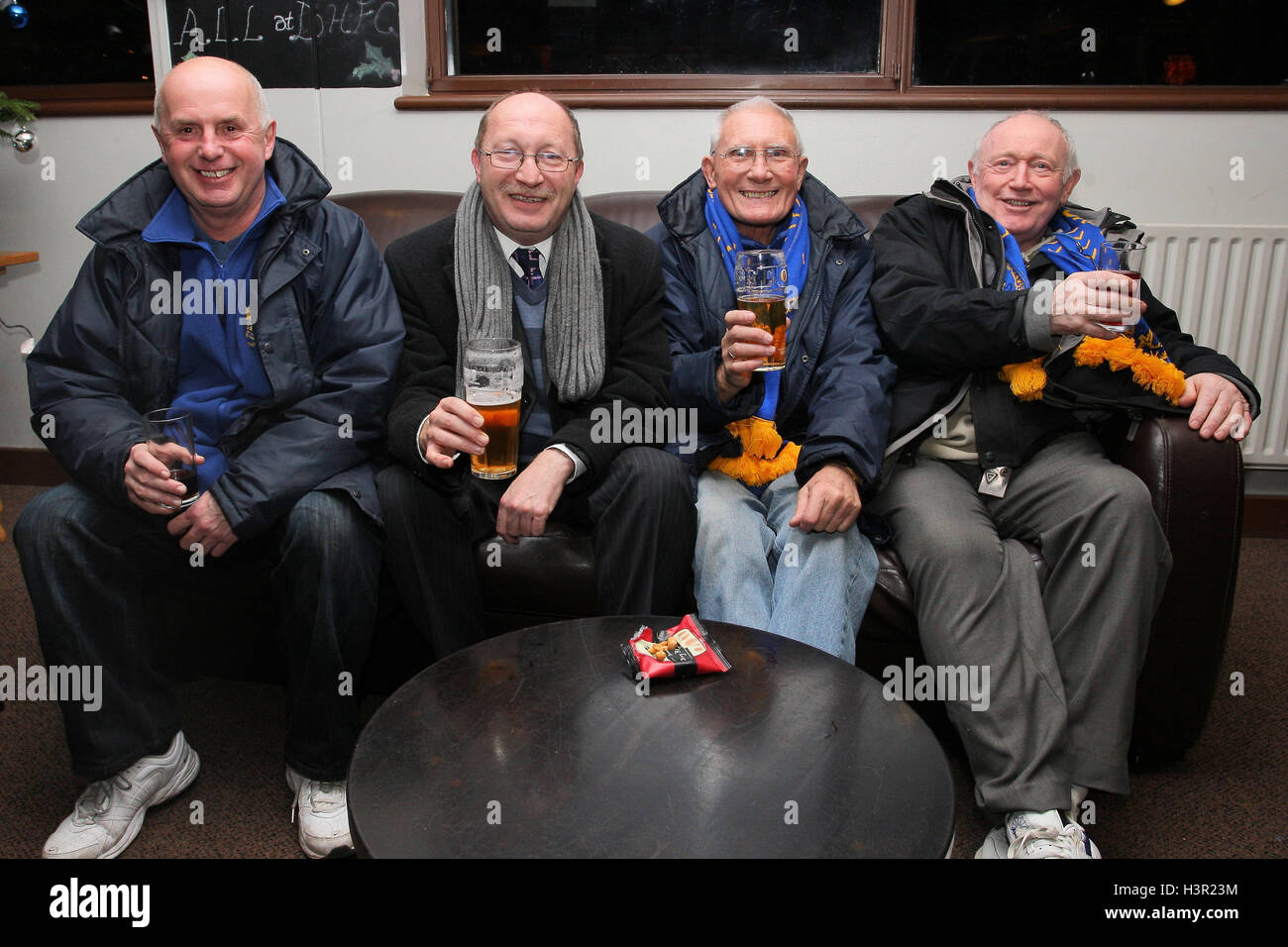 Romford fans enjoy a pint in the bar at Dulwich Hamlet FC before setting off for home. Romford's Championship Manager Cup match at Champion Hill was called off less than one hour before the scheduled kick-off time - 07/12/10 Stock Photo