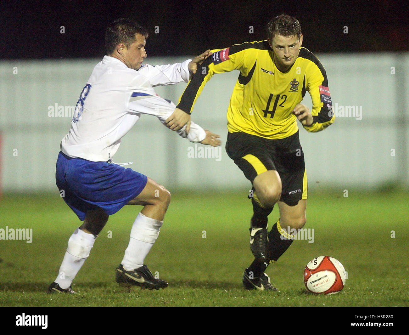 Bobby Port of Romford evades Rudi Hall - Enfield Town vs Romford - Ryman League Division One North at Brimsdown Rovers FC - 05/10/09 Stock Photo