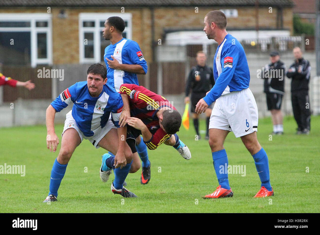 Craig Pope of Grays sends Tom Richardson of Romford tumbling Grays