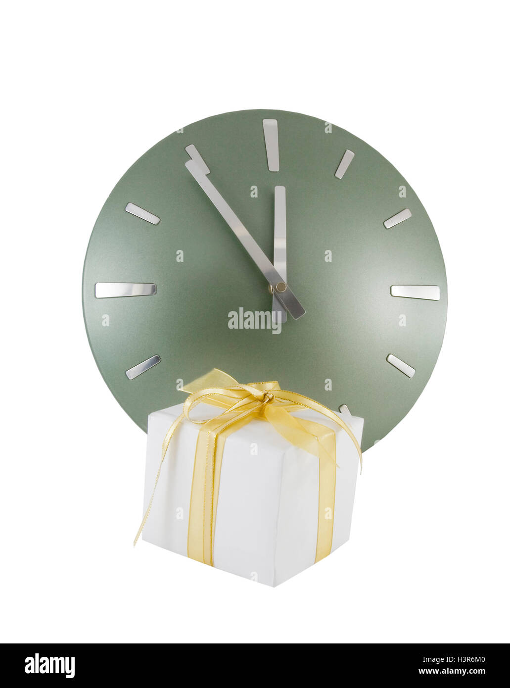 Clock (5 minutes to 12) with gift box over white Stock Photo