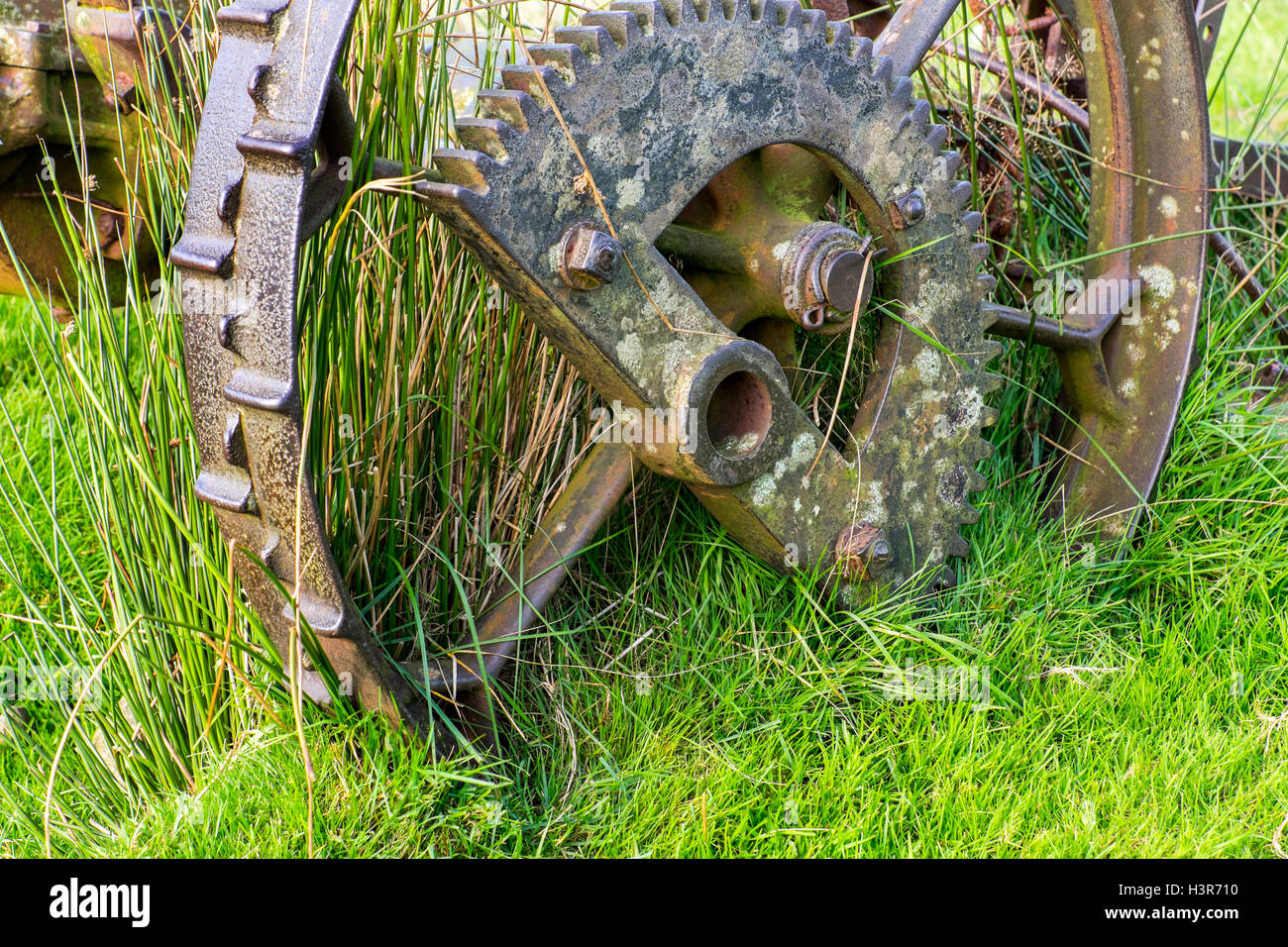 Obsolete farm machinery rusting on a hillside Stock Photo Alamy