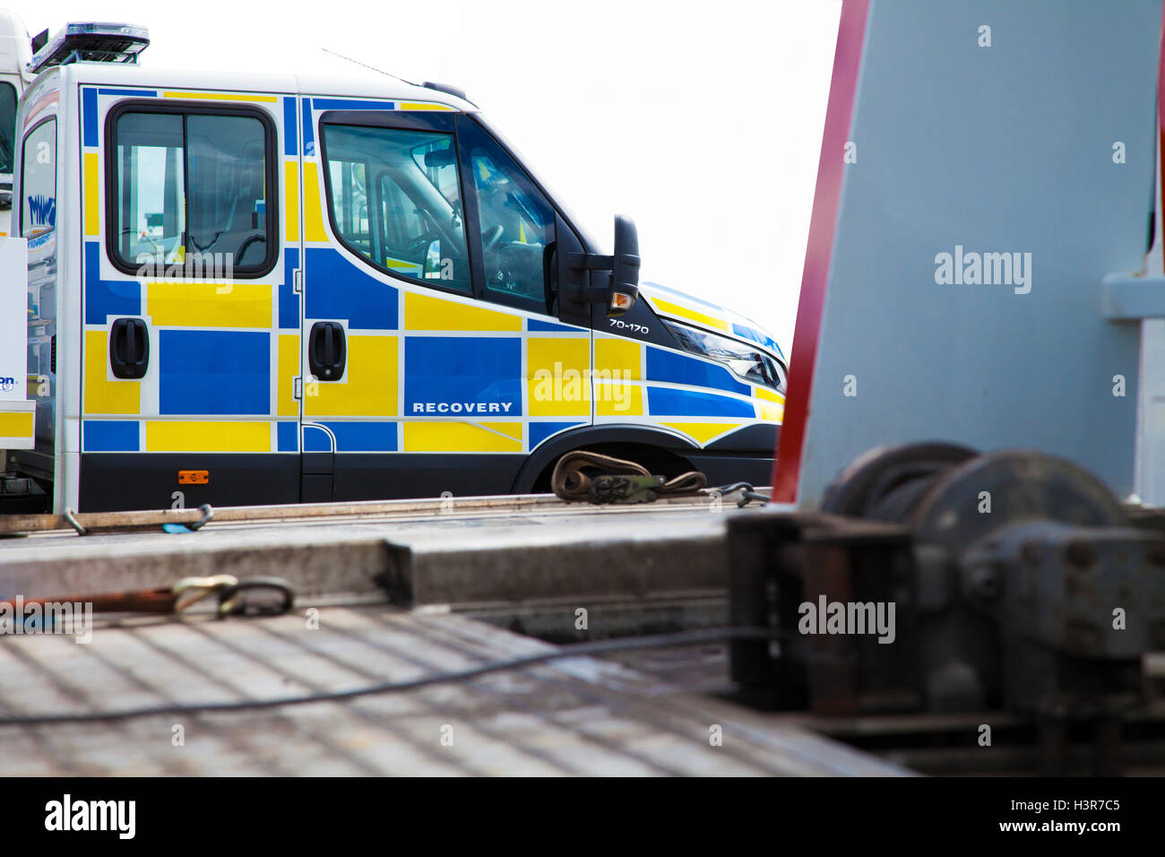 Recovery Truck,UK.The breakdown truck here is marked up in blue and yellow battenburg markings livery.Isolated on white Stock Photo