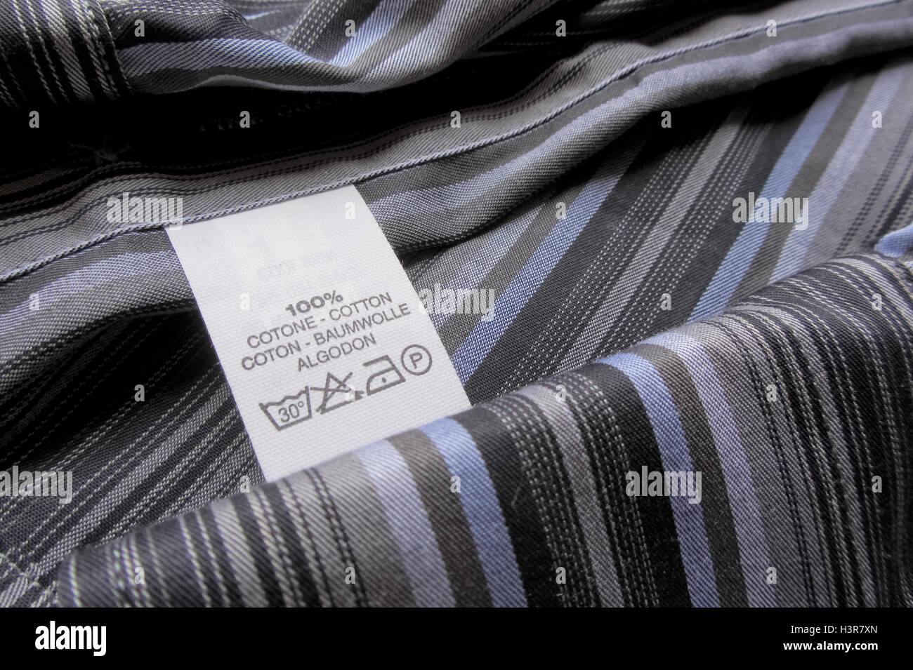 cotton vertical stripes shirt with washing label Stock Photo - Alamy