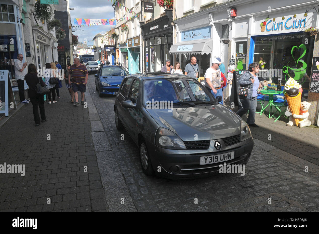 Cars moving through the narrow streets of Falmouth. Stock Photo
