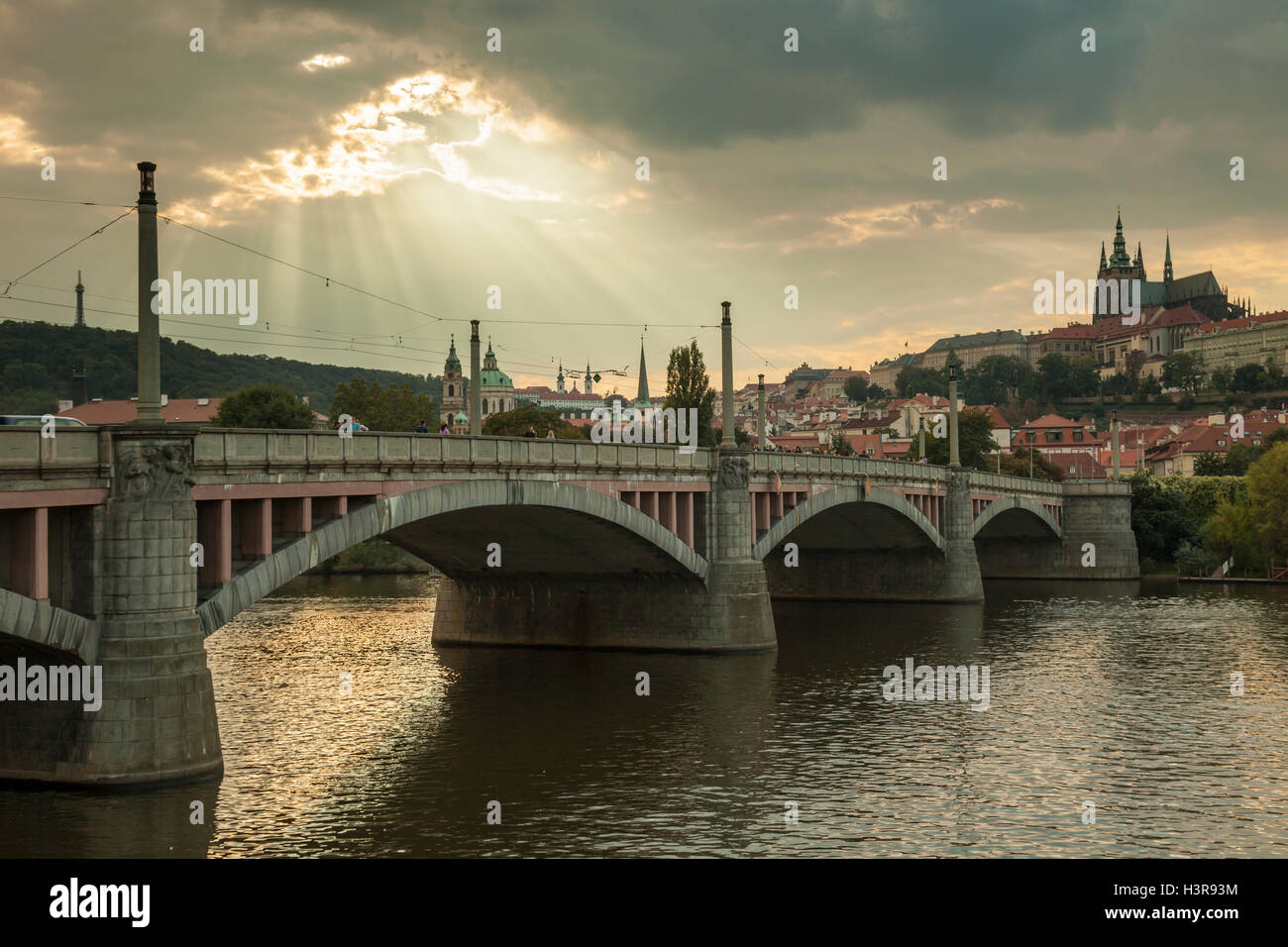 Sky open over Manes Bridge and Hradcany in Prague, Czech Republic. Stock Photo