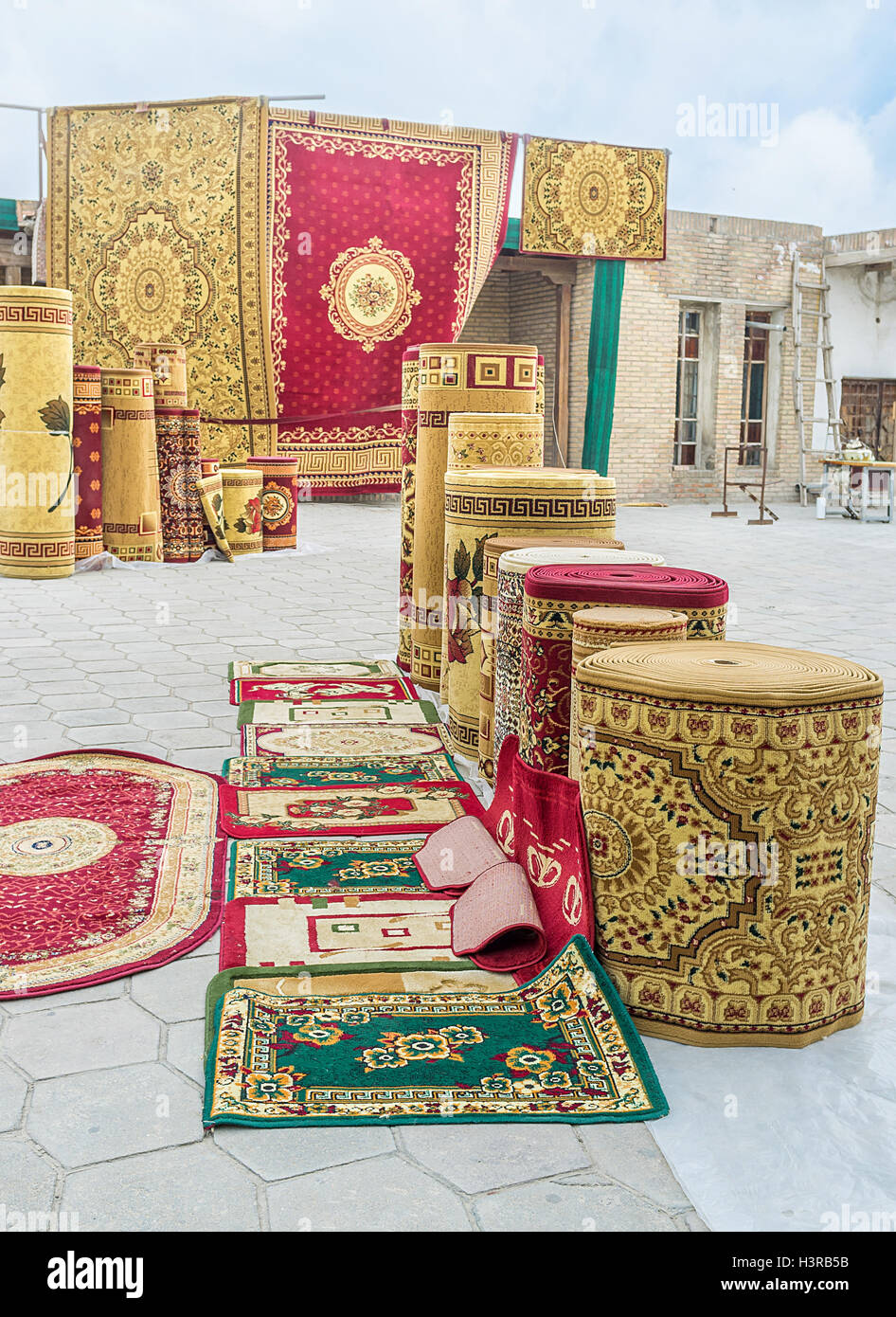 The wide range of different rugs at the traditional bazaar in Bukhara, Uzbekistan Stock Photo
