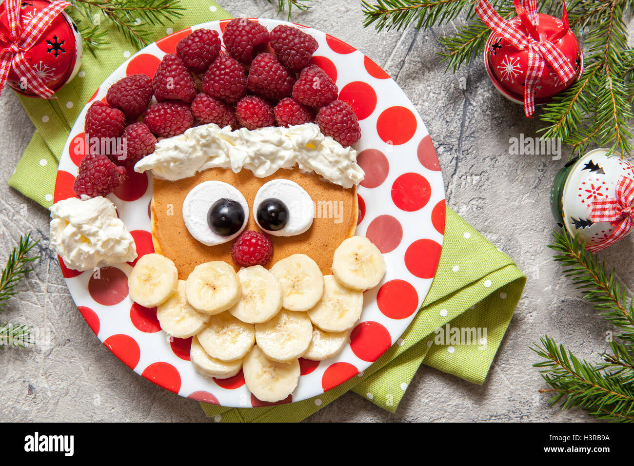 Santa pancake with raspberry for kid breakfast Stock Photo