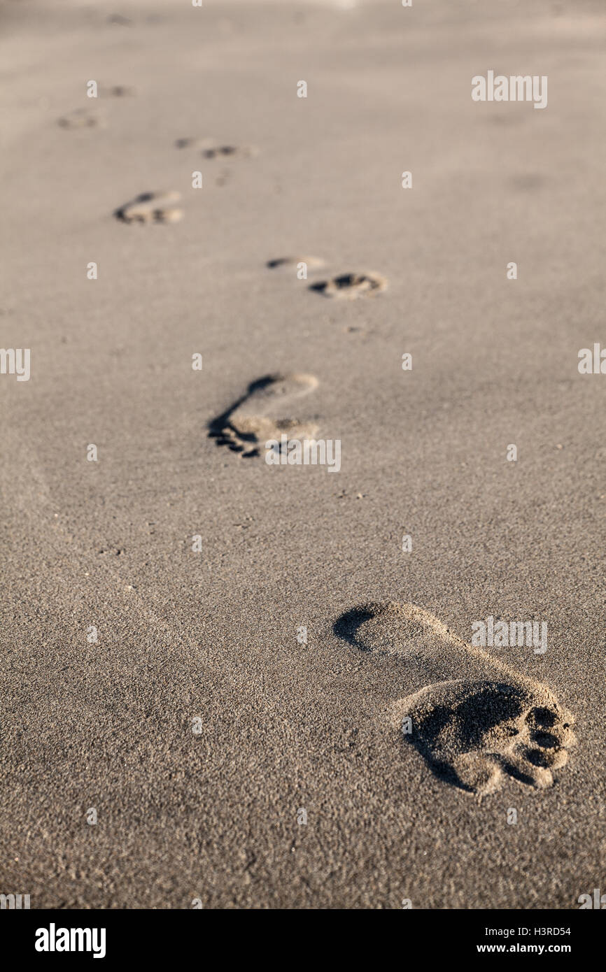 Footprints on a beach in California Stock Photo