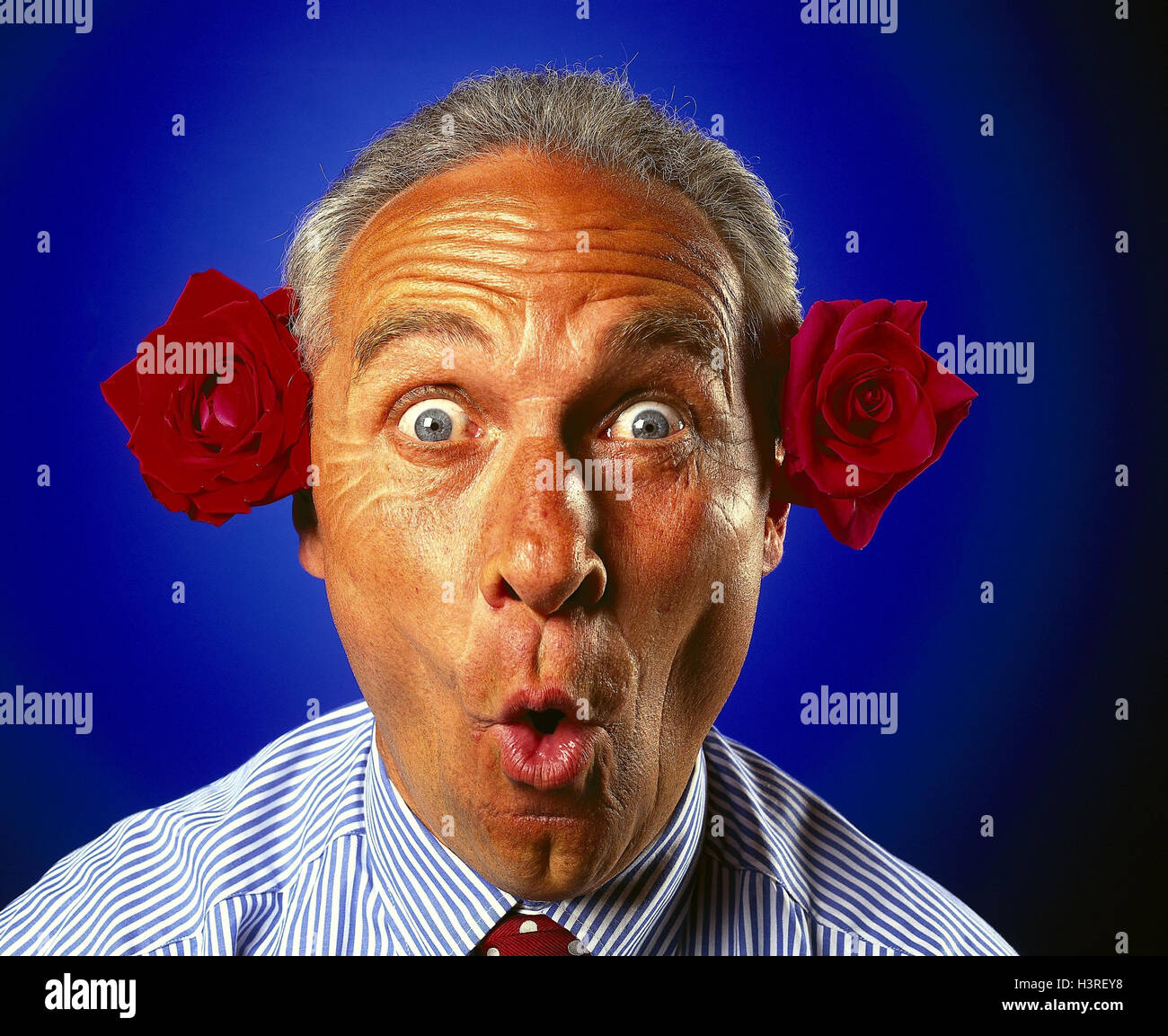 Man ears roses blossoms facial hi-res stock photography and images - Alamy