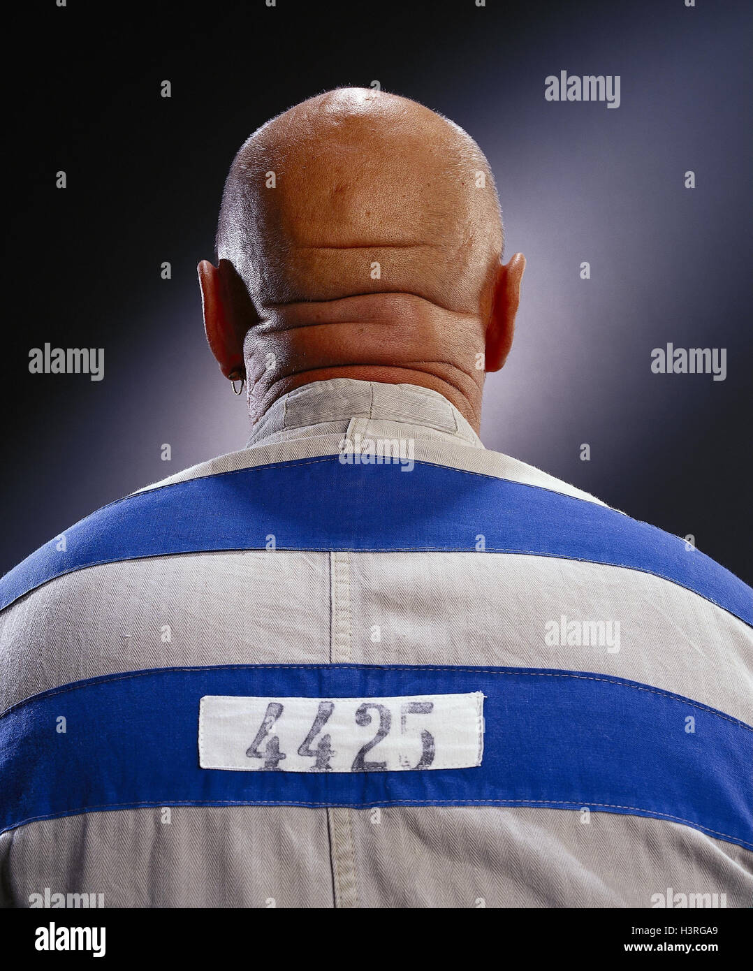 Prisoner, bald head, back view criminal activity, criminal, trapped