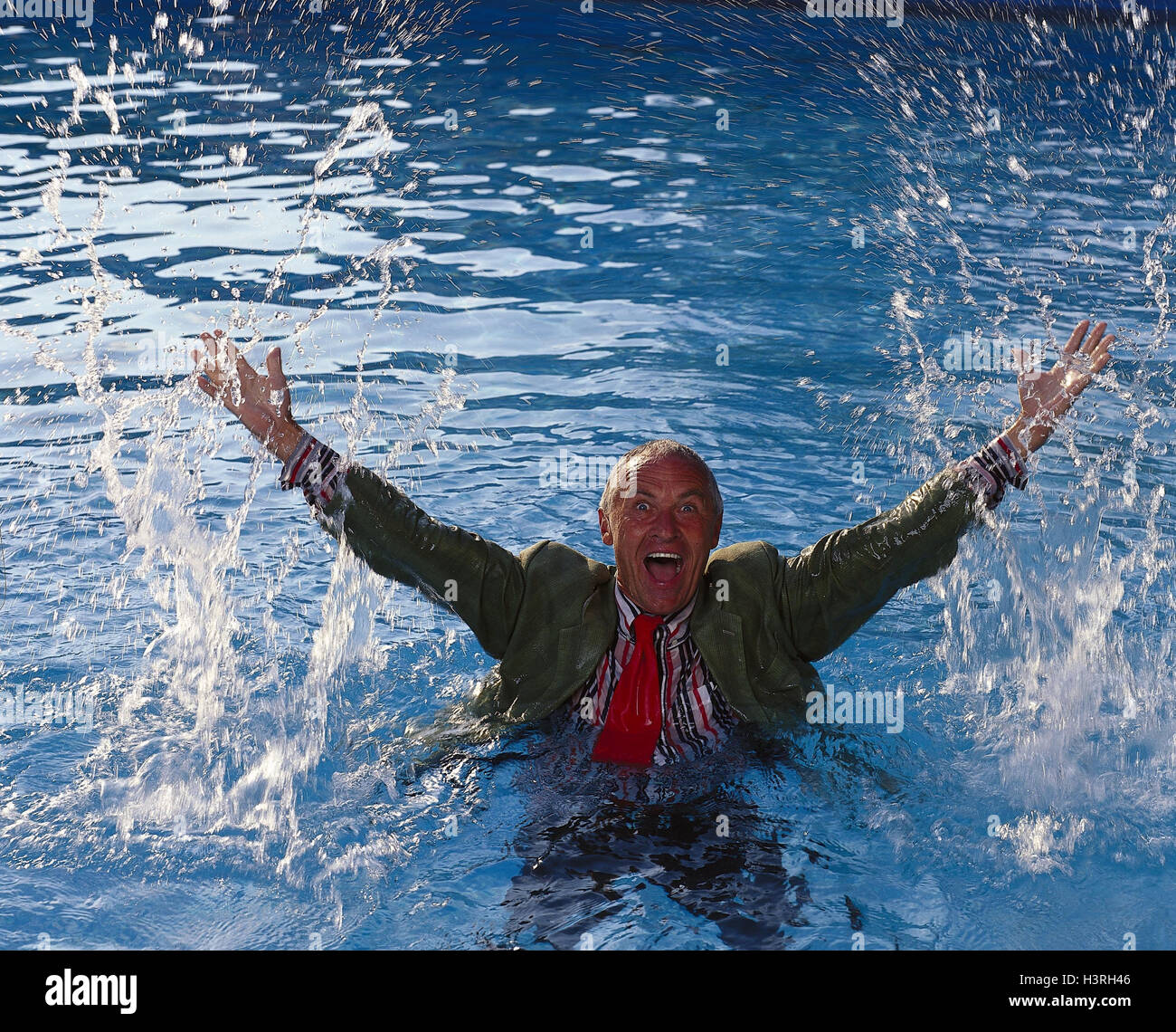 Man, middle old person, water, shout, gesture, clothes, wet, lake, sea, senior, arms rised, facial play, shout, emotion, rejoice, joy, enthusiasm, splash, refreshment, cry for help, predicament, desperation, fear, panic, drown, decline, non-float, outside Stock Photo