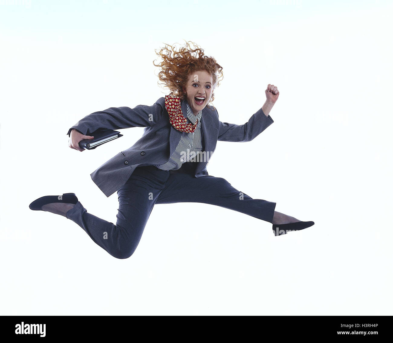 Businesswoman, suit, gesture, caper business, studio, cut out, woman, young, hairs, red, red-haired, dynamically, Elan, swing, lively, crack, jump, run, joy life, success, successfully, enthusiastically, enthusiasm, personal organizer, dynamics, women's p Stock Photo