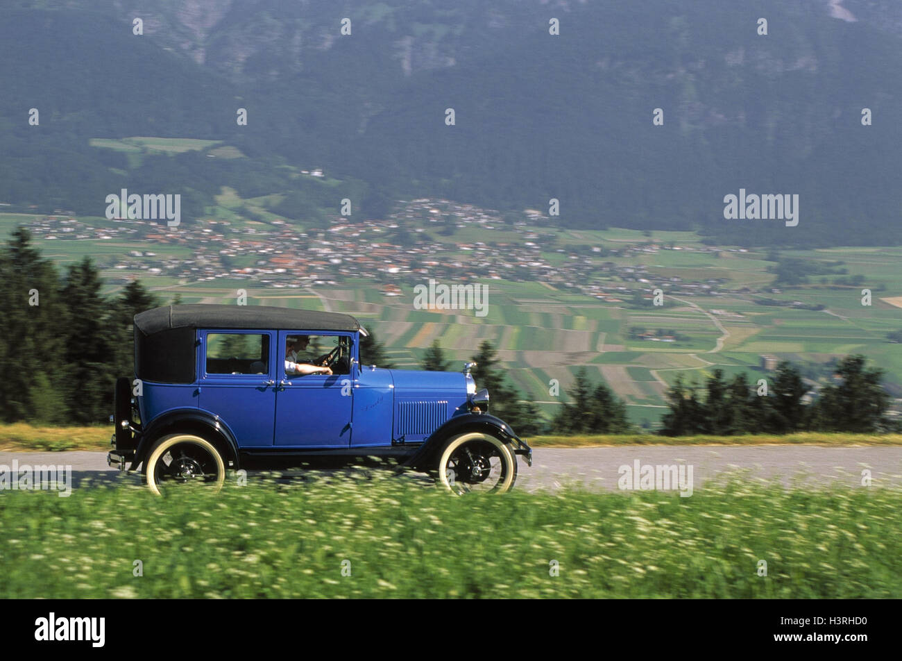 Car, old-timer, blue Ford of a (year construction in 1929) on country road, helped to pull Stock Photo