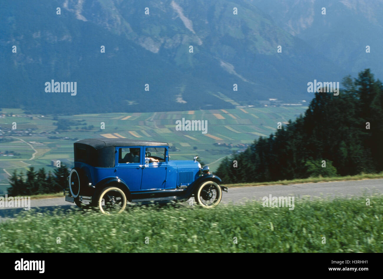 Car, old-timer, blue Ford of a (year construction in 1929) country road, helped to pull, mountain landscape, street, motion blur, valley view, view, nostalgia, summer, Stock Photo