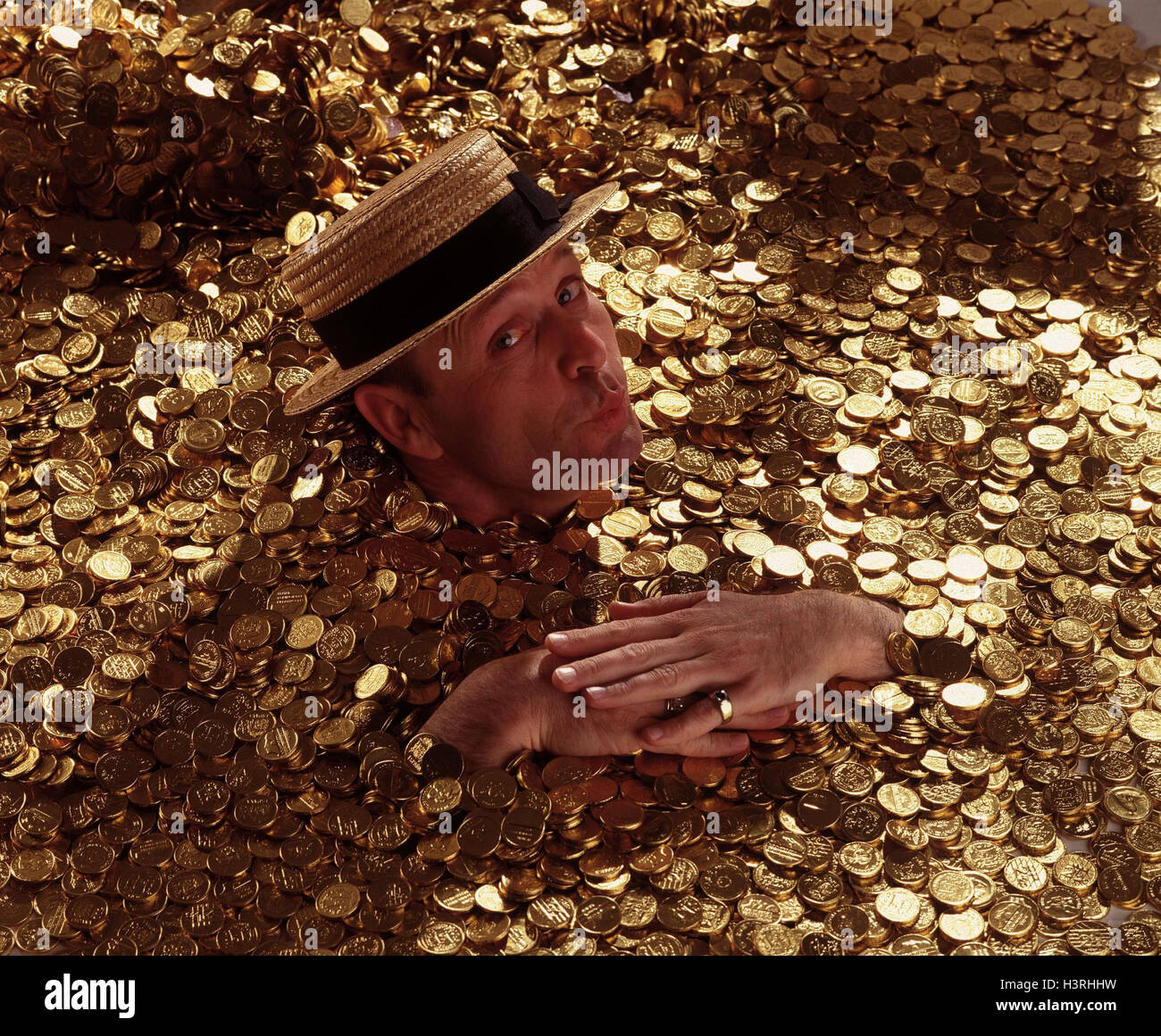 Golden coins, man, "golden bath" "swim in the money" "in the money sink