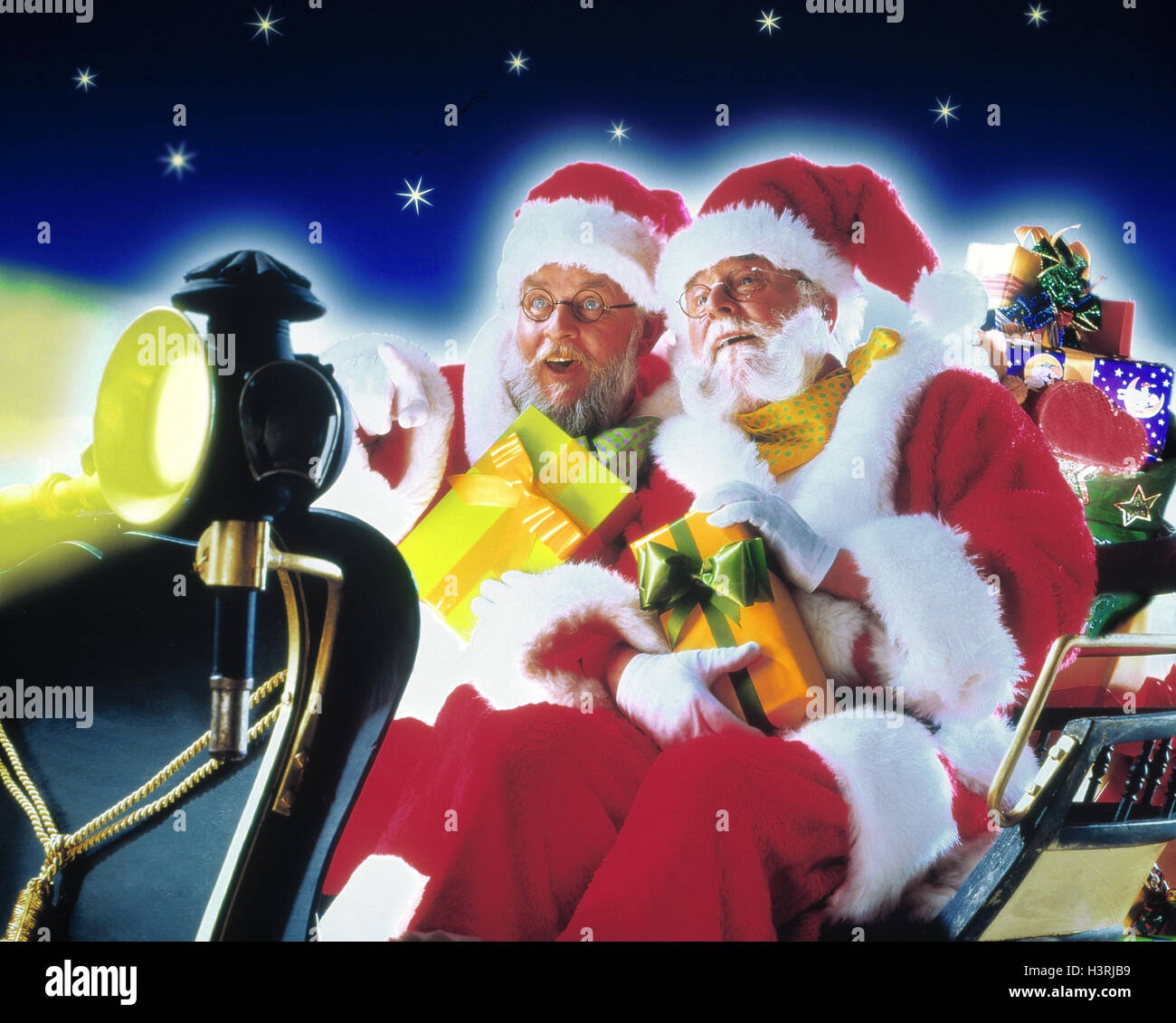 Slides, Santas, presents, gesture, pointing, detail, Christmas, Santa Claus, two, Santa, Santas, Christmas presents, headlights, lamp, joy, is astonished, studio Stock Photo