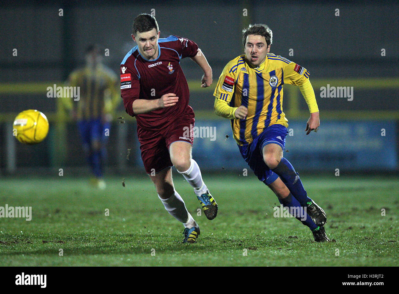 Kurt Smith of Romford evades Sam West of Brentwood - Romford vs Brentwood Town - Ryman League Division One North Football at Ship Lane, Thurrock FC - 09/01/13 Stock Photo