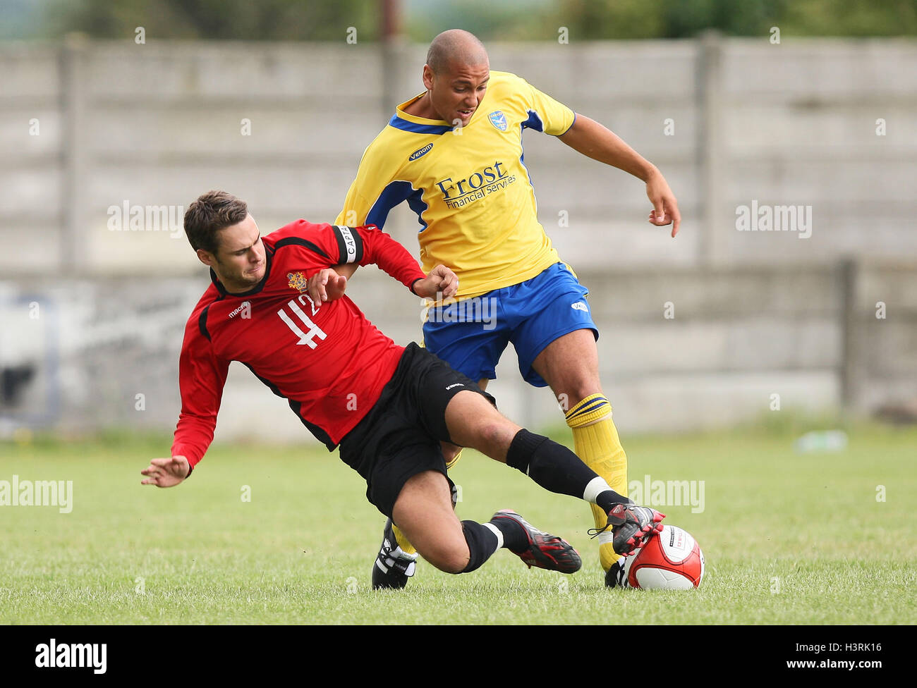 Leon Gordon of Canvey is tackled by Paul Clayton of Romford - Romford vs Canvey Island - Pre-Season Friendly Football at Mill Field, Aveley FC - 11/07/09. Stock Photo