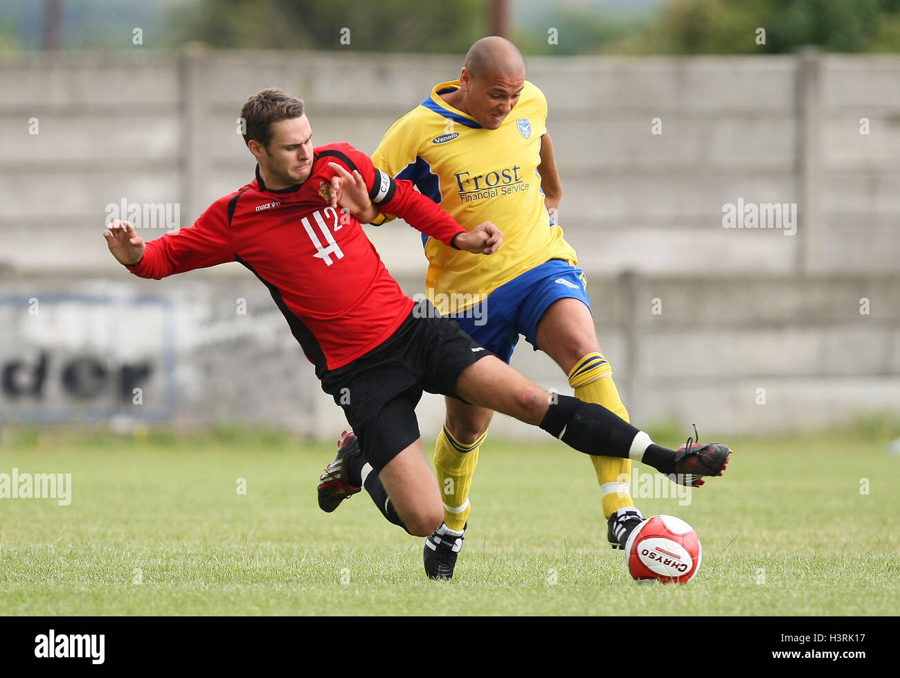 Leon Gordon of Canvey is tackled by Paul Clayton of Romford - Romford vs Canvey Island - Pre-Season Friendly Football at Mill Field, Aveley FC - 11/07/09. Stock Photo