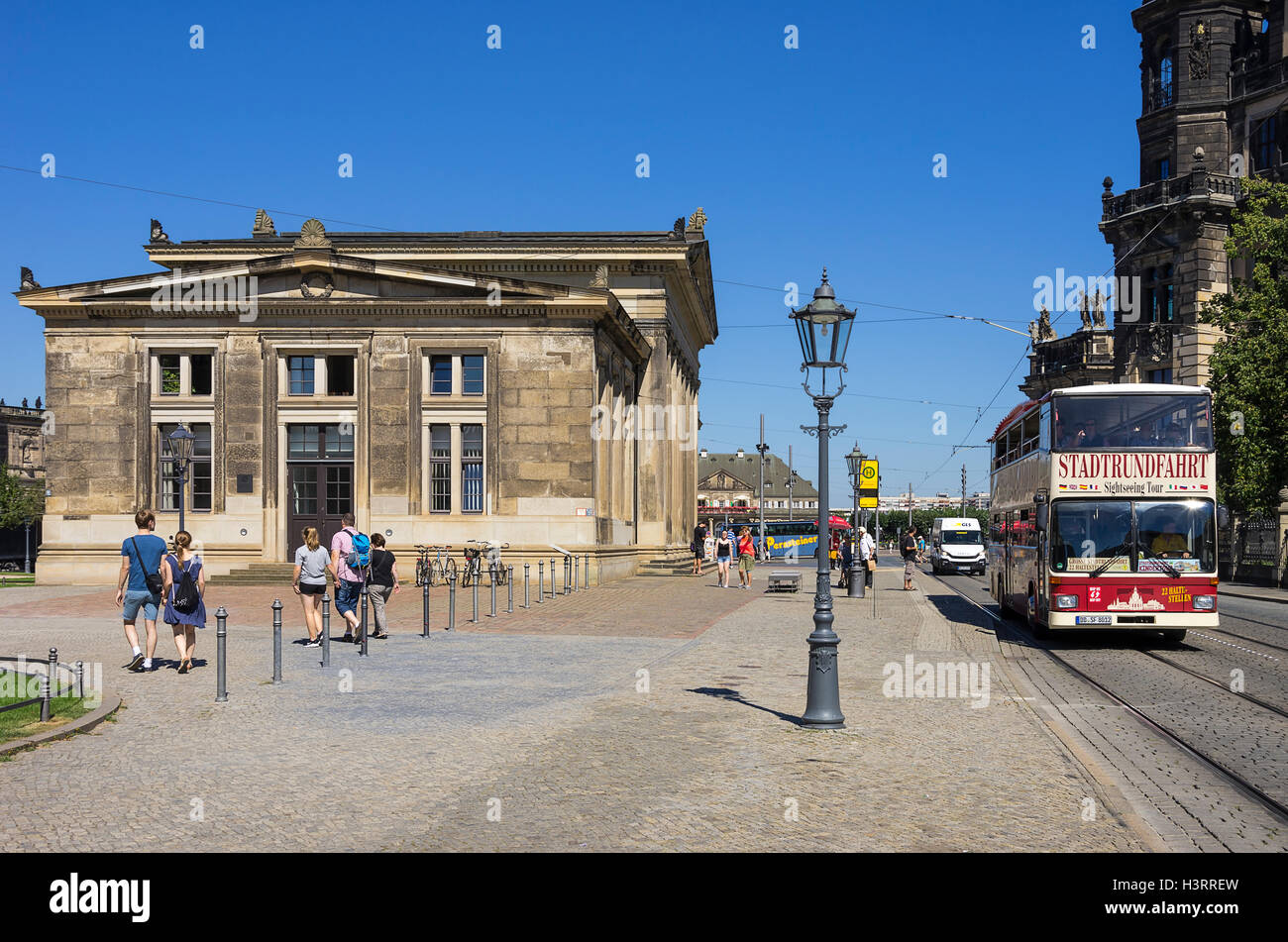 A double-decker bus for sightseeing tours approaches in the city of Dresden, Saxony, Germany. Stock Photo