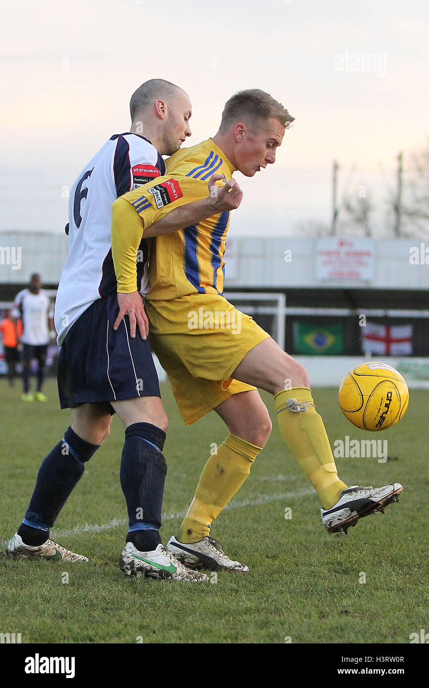 Ben Jones of Romford shields the ball from Paul White of Witham - Witham Town vs Romford - Ryman League Division One North Football at Spa Road, Witham, Essex - 15/12/12 Stock Photo