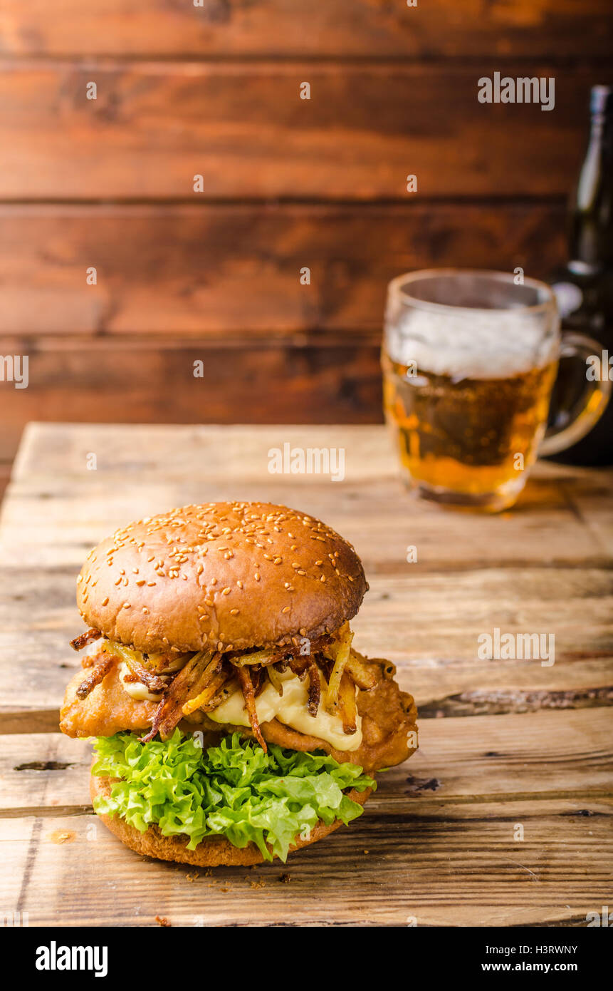 Fish and Chips Burger with fried potato straw and grilled portobello