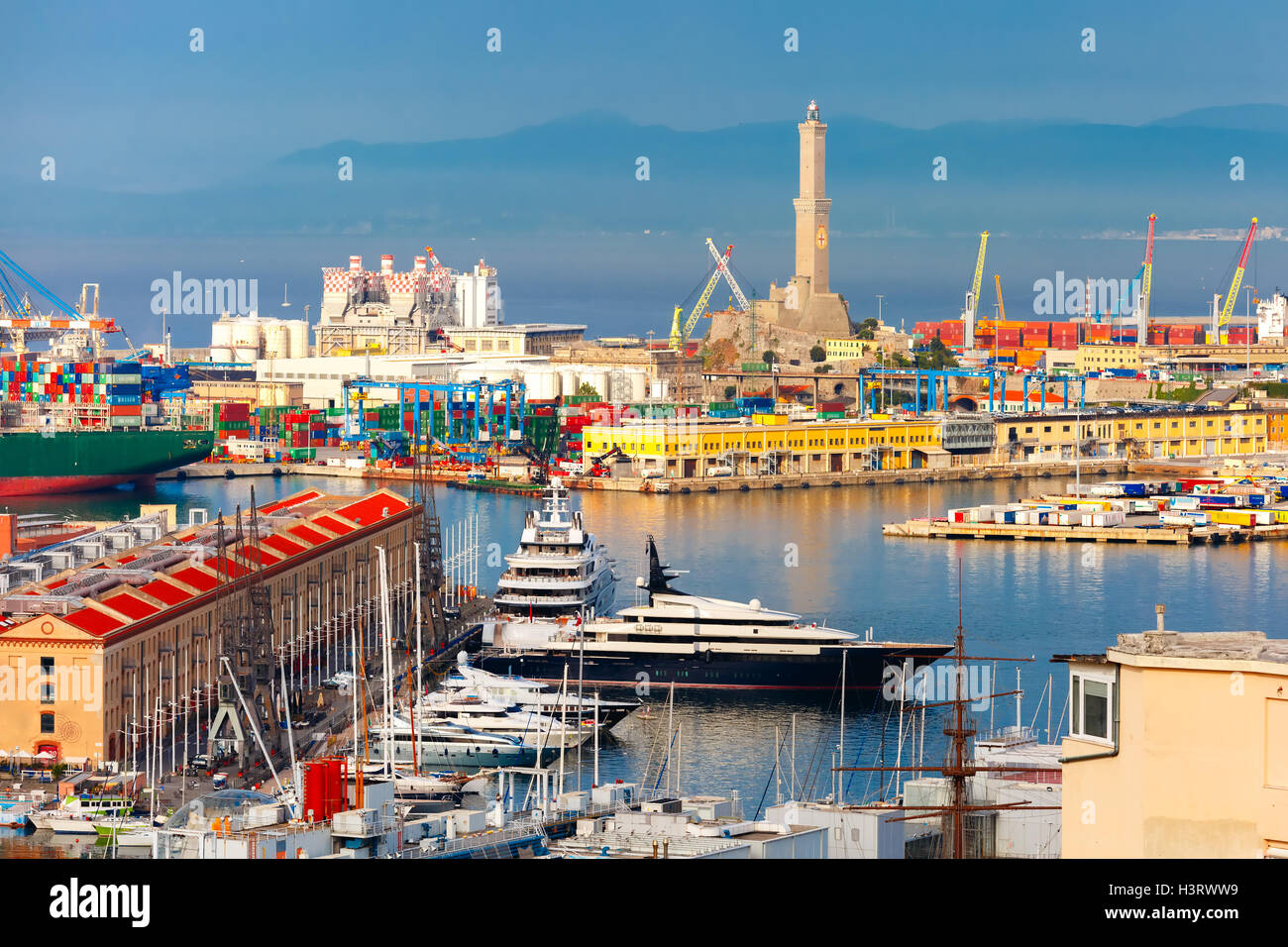 Old Lighthouse in port of Genoa, Italy. Stock Photo