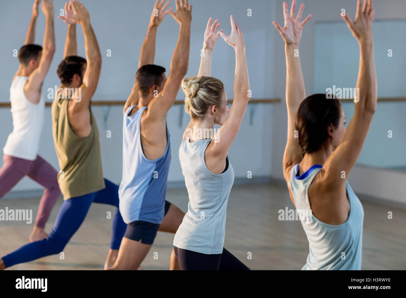 Group of fitness team performing stretching exercise Stock Photo - Alamy