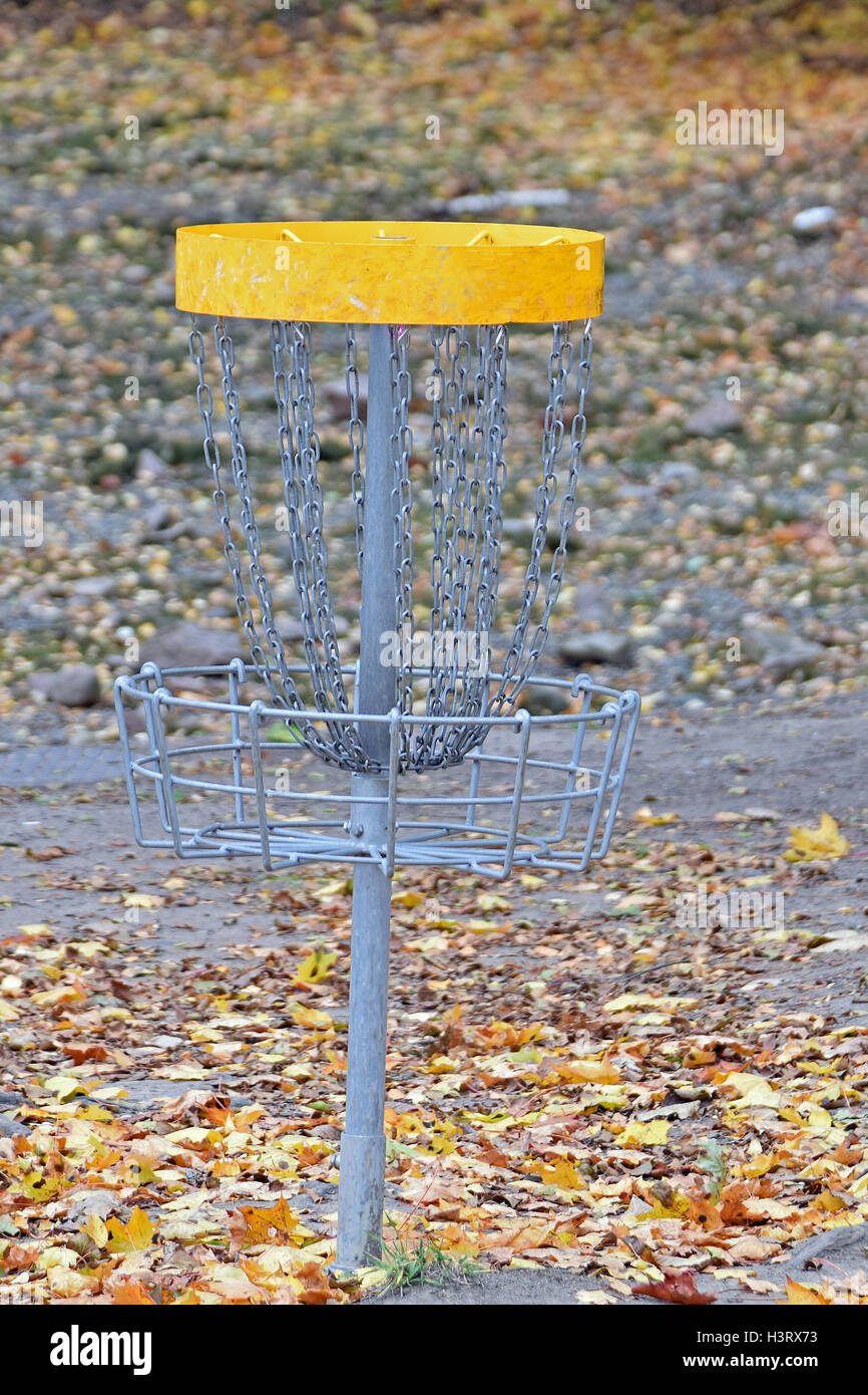 Disc golf target in the park on autumn Stock Photo Alamy