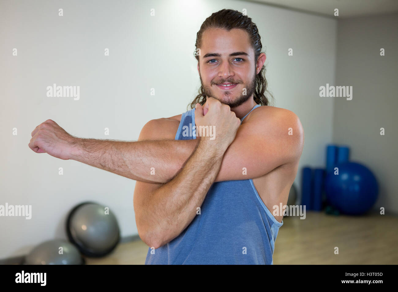 Smiling man doing aerobic exercise Stock Photo