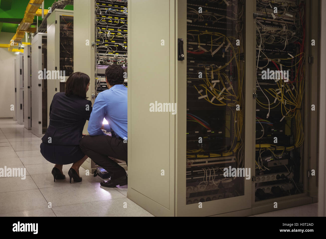 Technicians analyzing server Stock Photo - Alamy