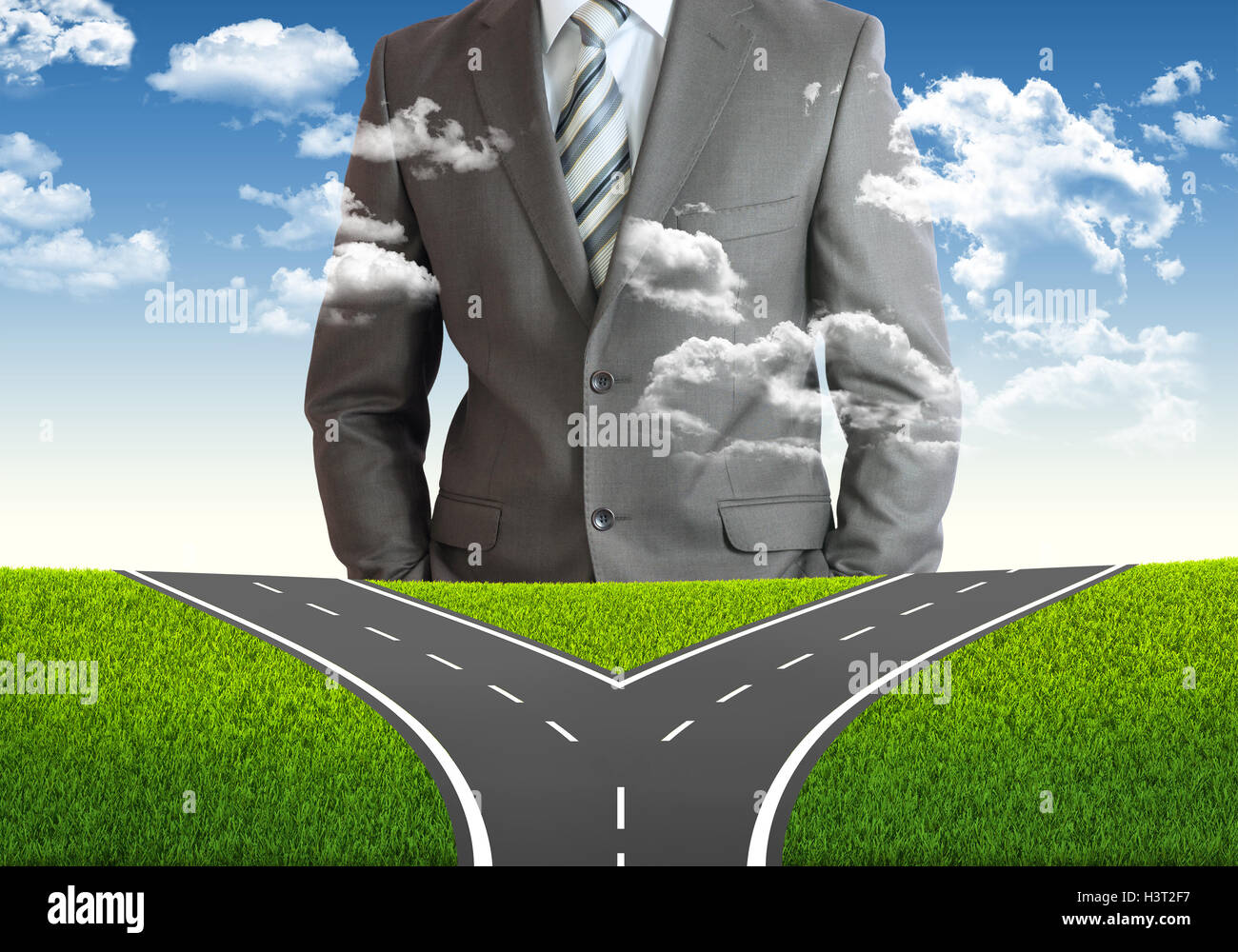 Businessman and fork in the road Stock Photo