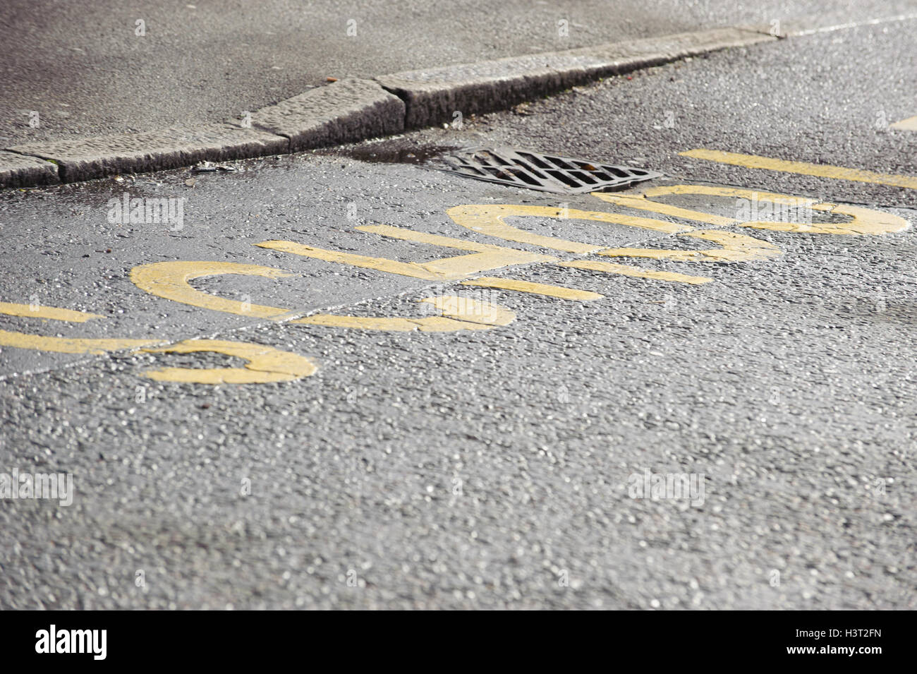 road markings in yellow paint outside School, UK Stock Photo
