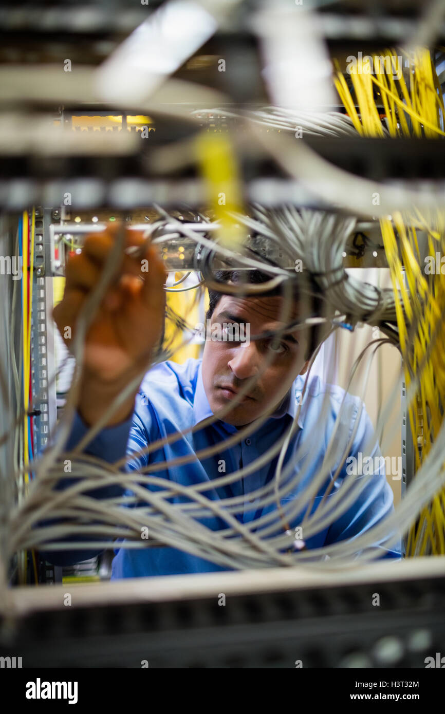 Technician fixing cable Stock Photo Alamy