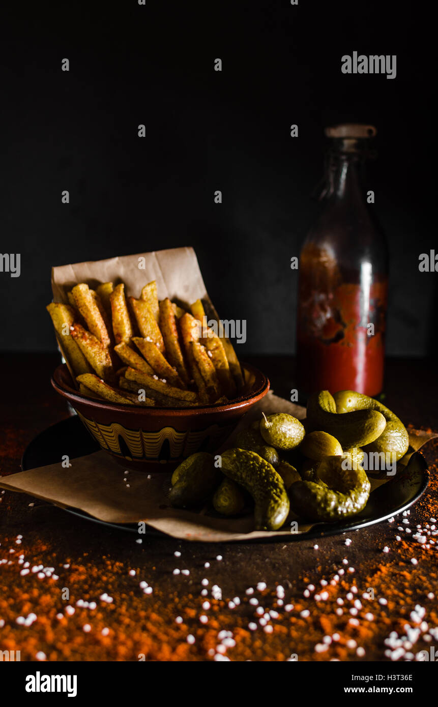 French fries and homemade ketchup, pickles, all homemade Stock Photo Alamy
