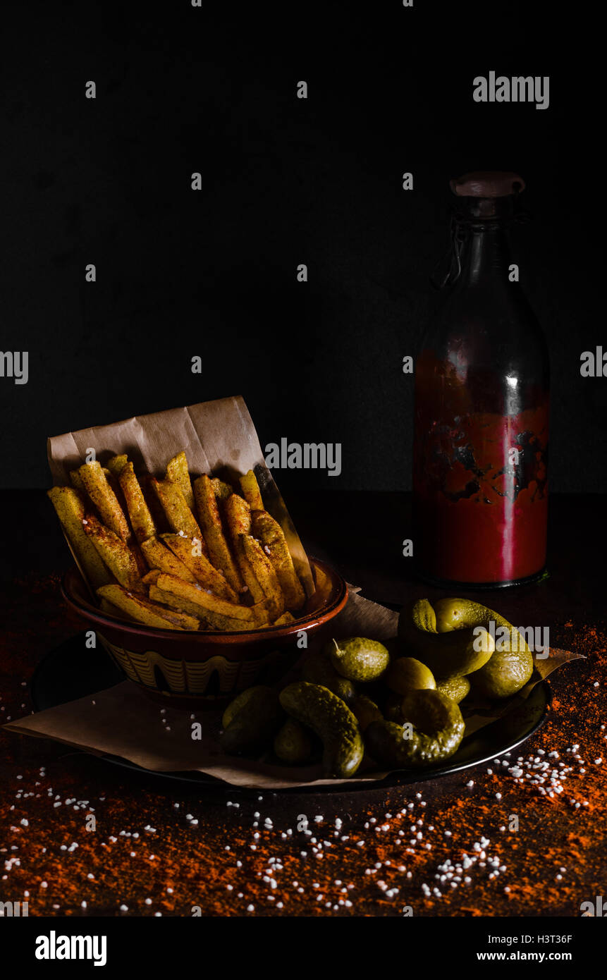 French fries and homemade ketchup, pickles, all homemade Stock Photo Alamy