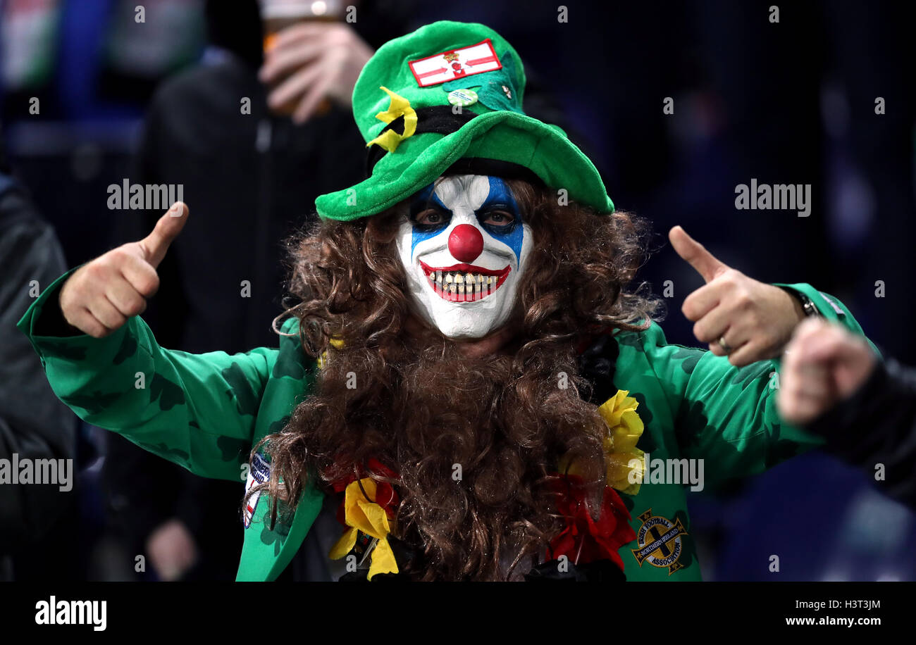 A Northern Ireland fan in the stands in a scary clown fancy dress during the 2018 FIFA World Cup Qualifying match at the HDI Arena, Hannover. Stock Photo
