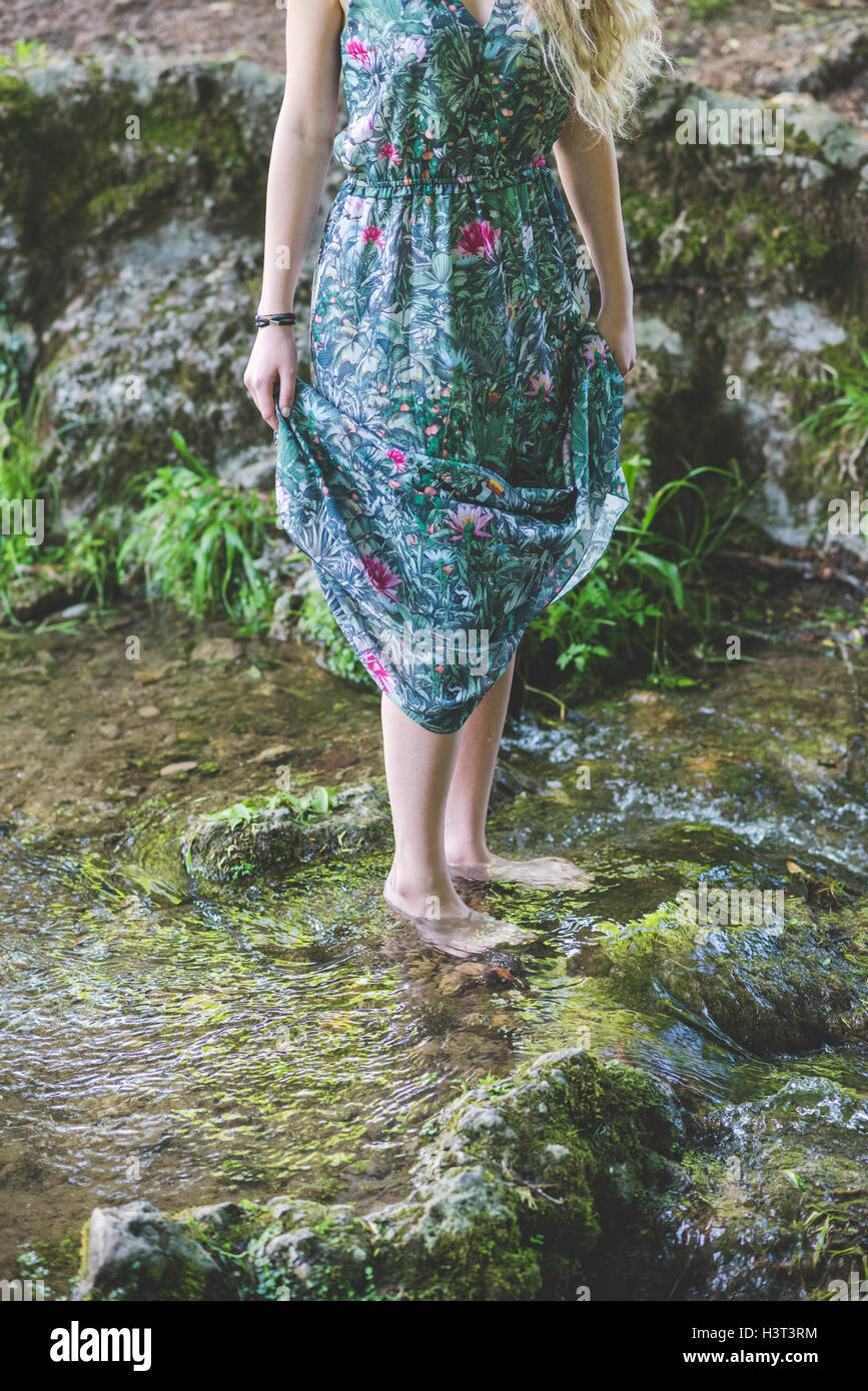 Young barefoot woman wearing skirt hi-res stock photography and images