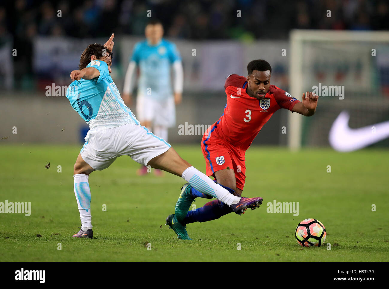 Slovenia's Rene Krhin (left) and England's Danny Rose (right) battle for the ball during the 2018 FIFA World Cup Qualifying match at the Stozice Stadium, Ljubljana. Stock Photo