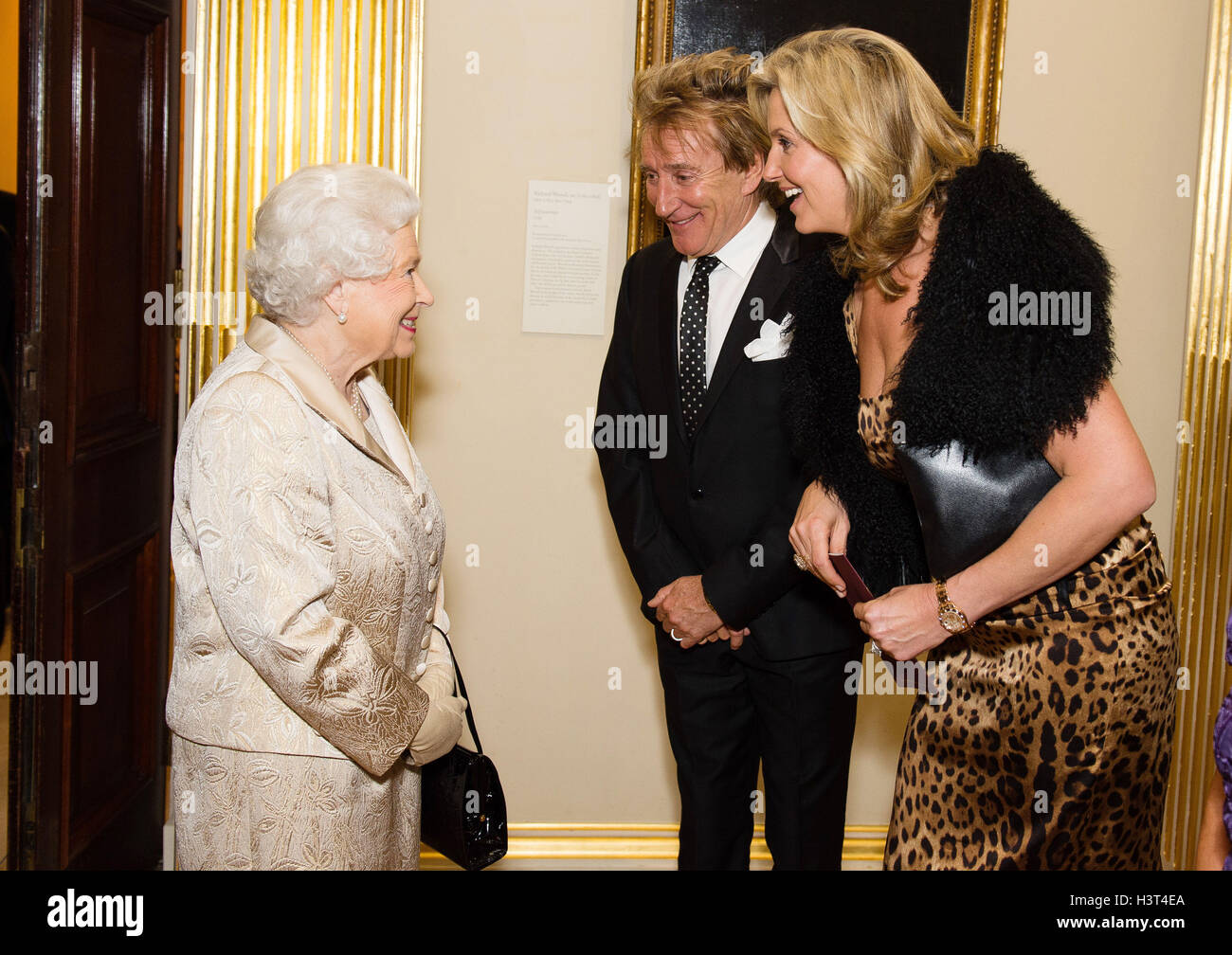 The Queen meets Sir Rod Stewart and his wife Penny Lancaster during a ...