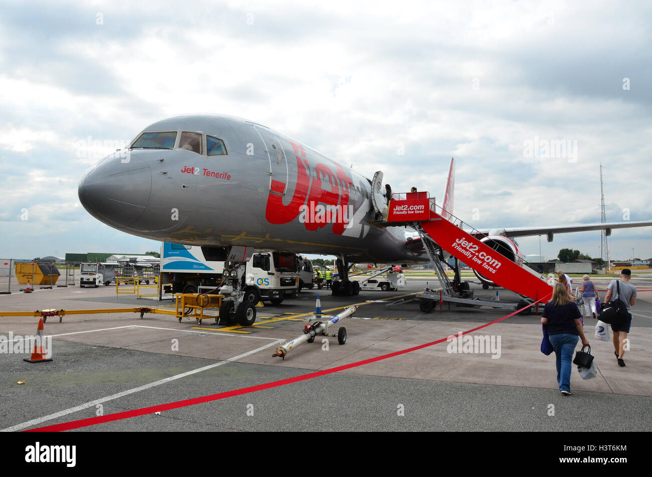 Customers board a Jet 2 Flight to Tenerife at Manchester Airport Stock Photo - Alamy
