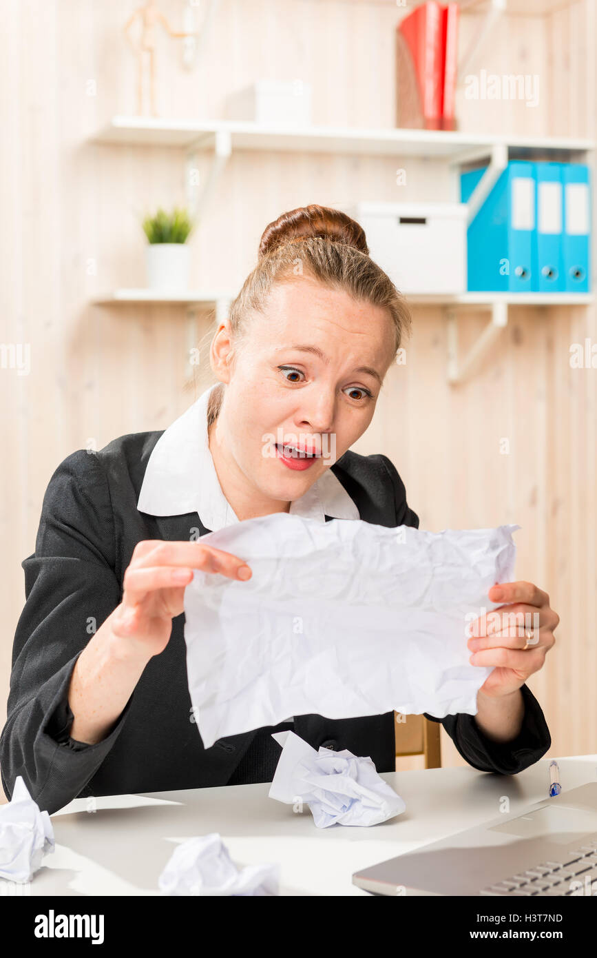 discouraged accountant found the important paper in the trash Stock Photo